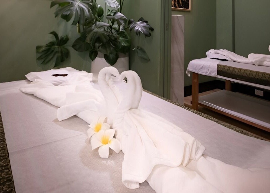 Relaxing massage tables adorned with towel swans at The One Remedial Massage and Spa Five Dock, Five Dock, New South Wales, AU.