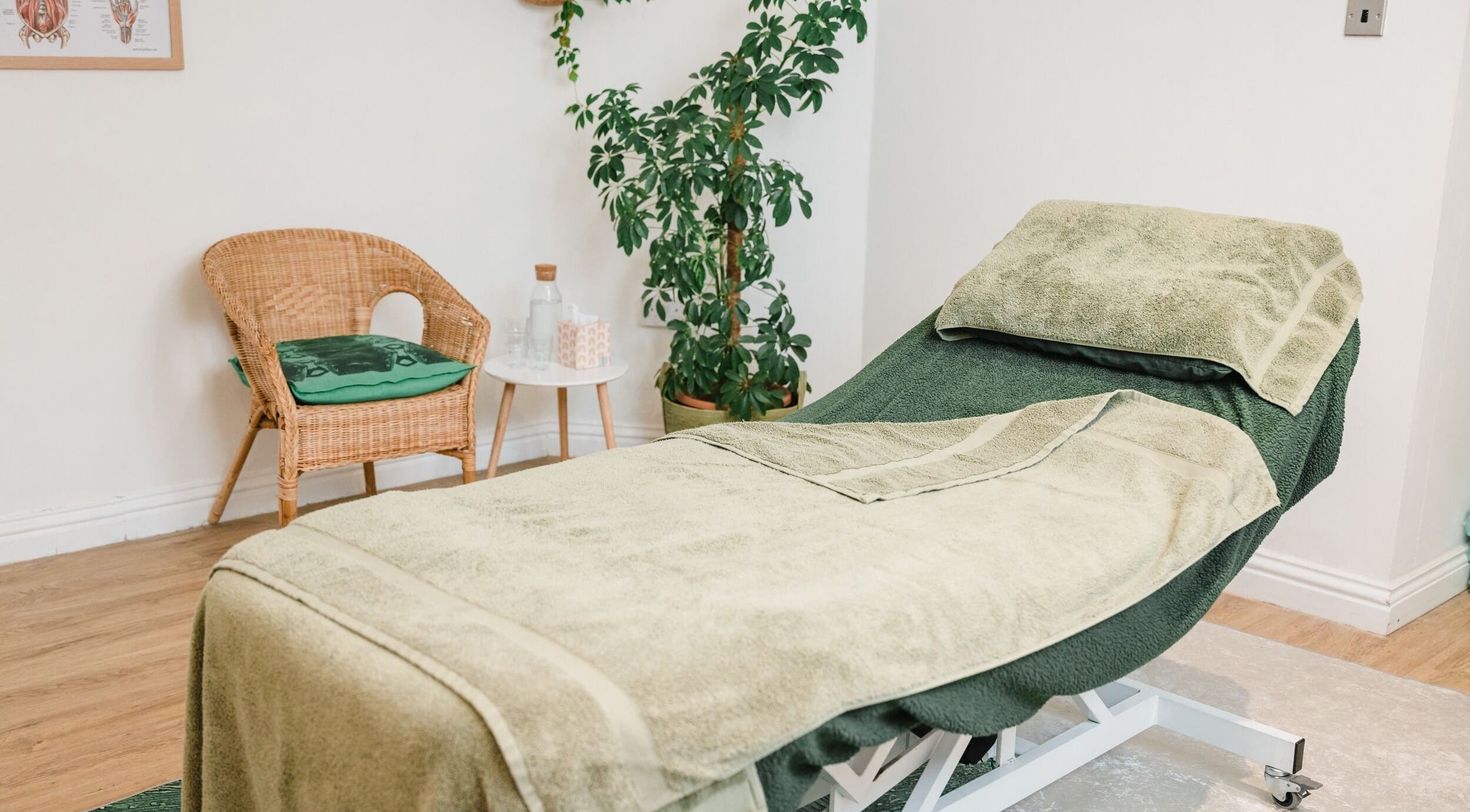 Relaxing treatment room at Bloom Well Being, Newcastle upon Tyne, England, GB with cozy decor and greenery.