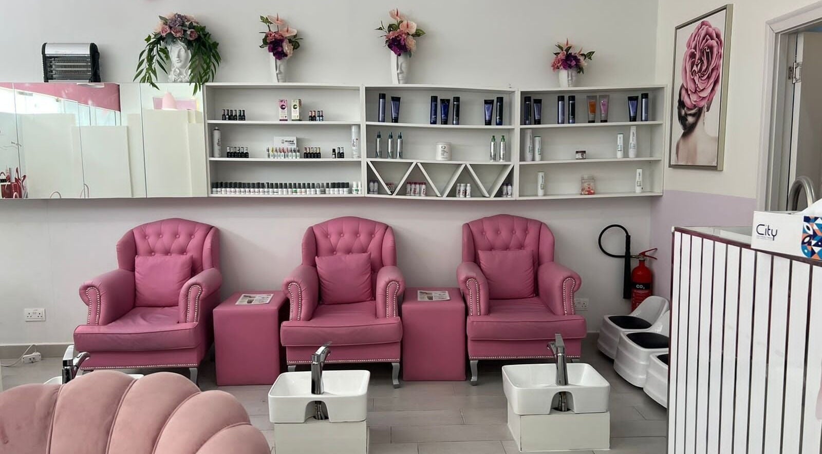 Chic pink seating at Intime Ladies Salon, دبي, دبي, AE, with elegant decor and beauty products on display.