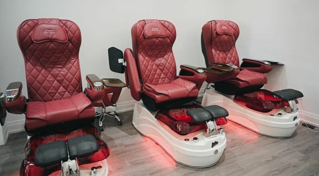 Elegant red pedicure chairs at Supreme Nail Spa in Toronto, Ontario, CA offering luxurious salon experience.