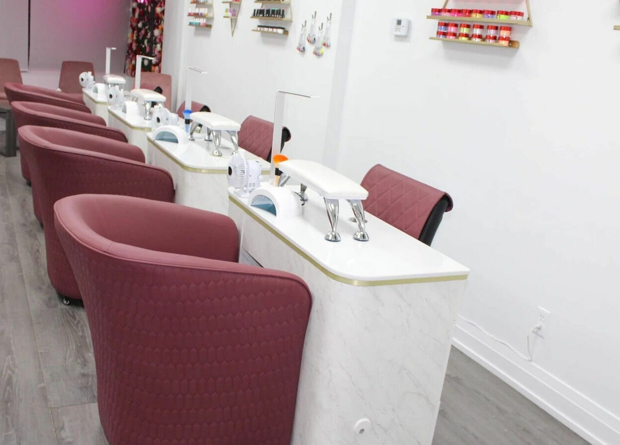 Modern nail stations at Supreme Nail Spa, Toronto, Ontario, CA, with elegant furnishings and vibrant decor.