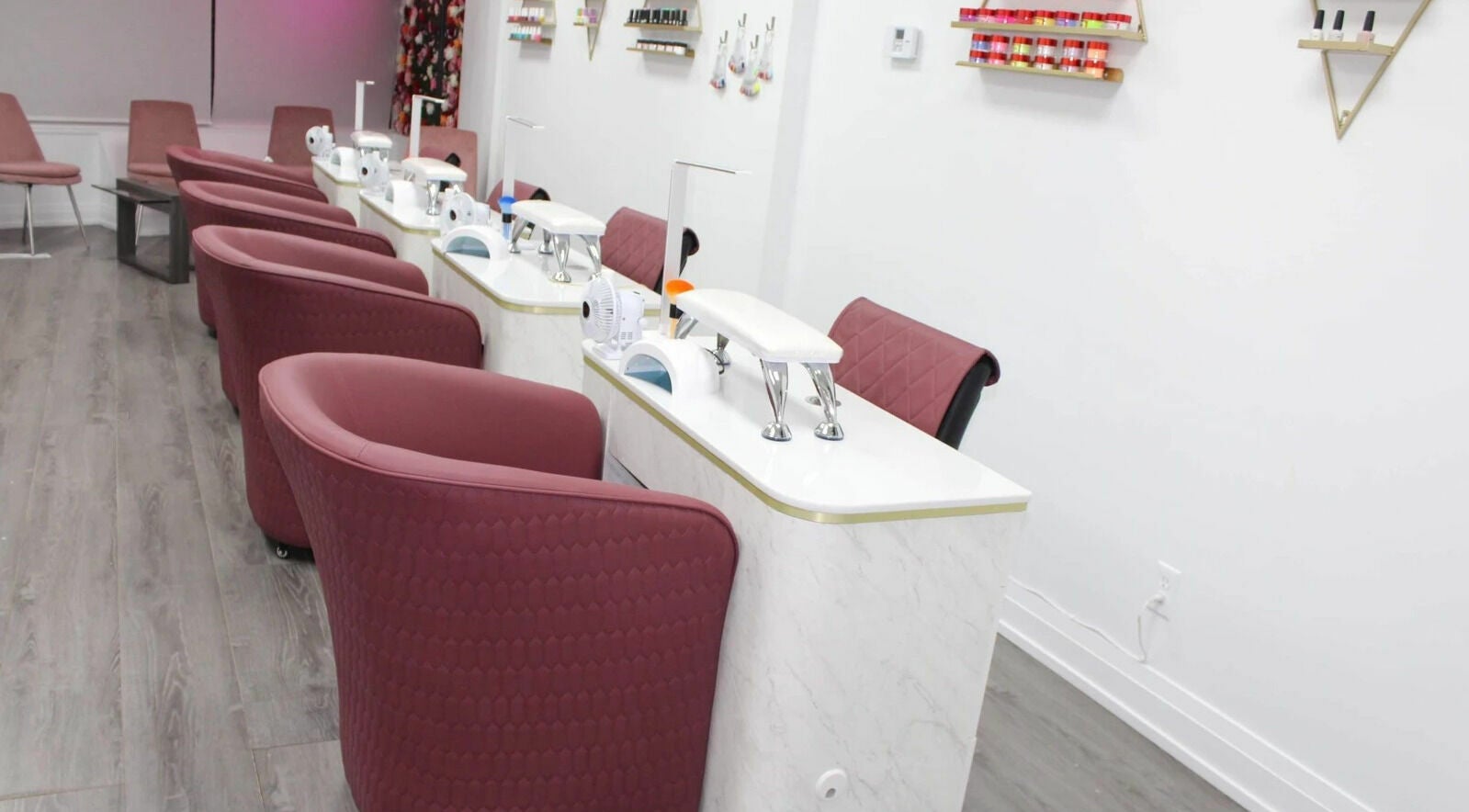 Modern nail stations at Supreme Nail Spa, Toronto, Ontario, CA, with elegant furnishings and vibrant decor.