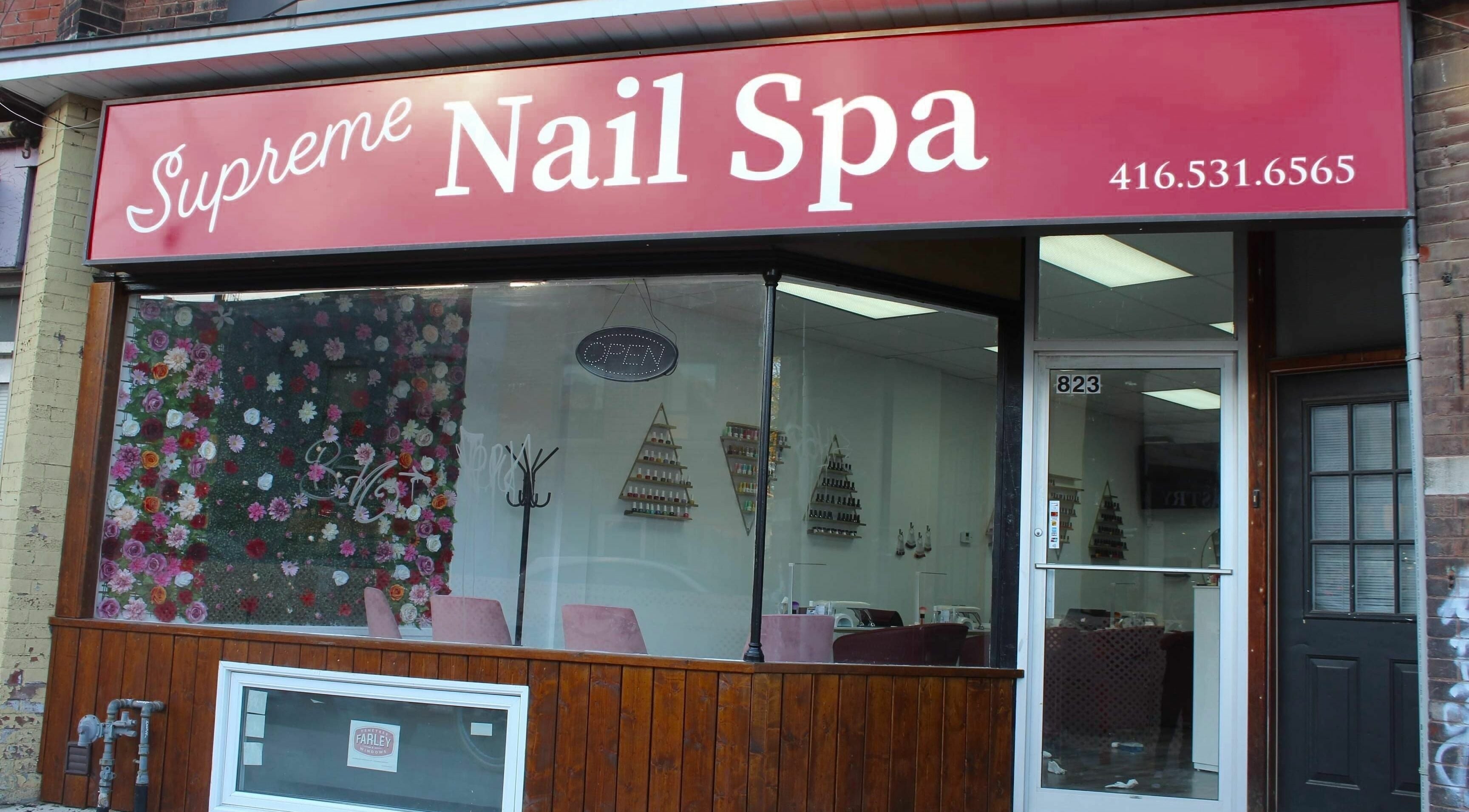 Exterior of Supreme Nail Spa in Toronto, Ontario, CA, showcasing its inviting entrance and floral decor.