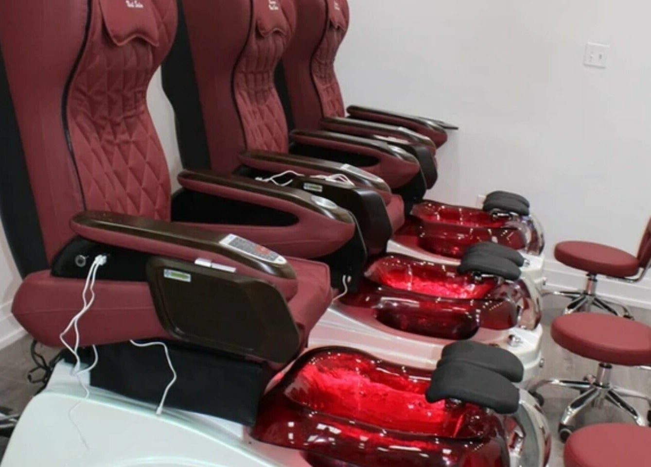 Luxurious pedicure chairs at Supreme Nail Spa, Toronto, Ontario, CA, offering top-notch nail care experience.