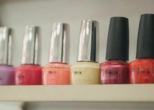 Colorful nail polishes on display at Supreme Nail Spa in Toronto, Ontario, CA for perfect manicures.