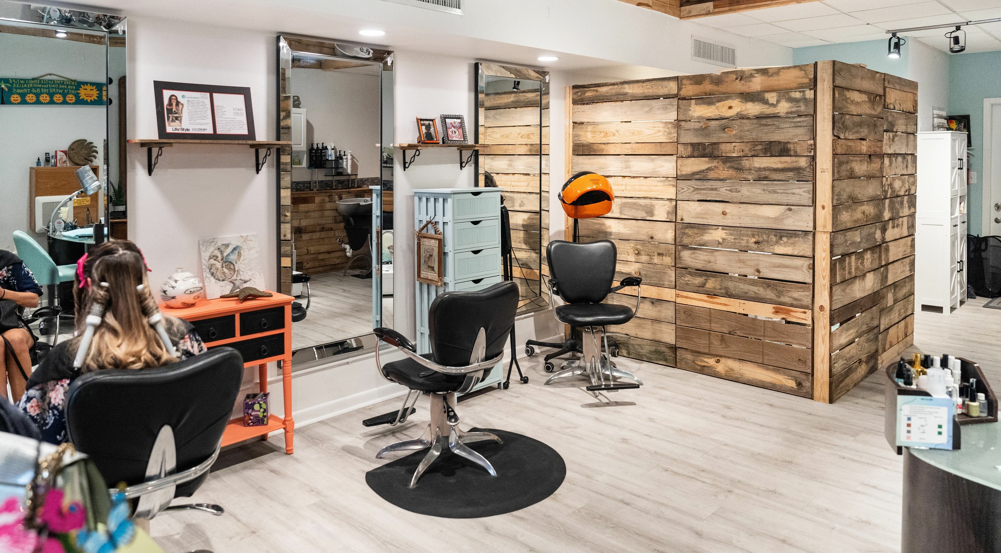 Modern styling chairs and mirrors at The Wild Berry Salon, Lauderdale by the Sea, Florida, US.