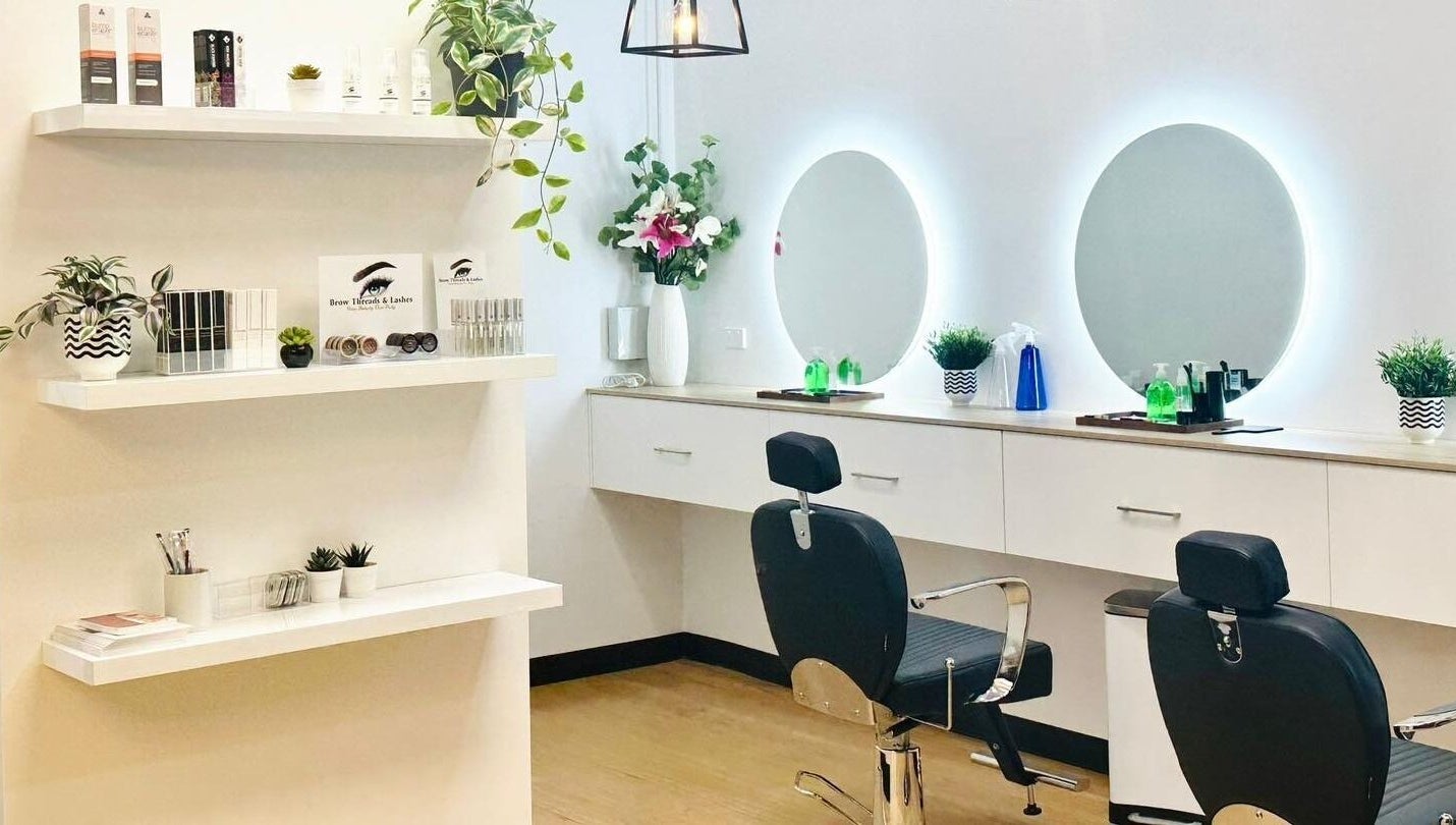 Modern beauty studio at Brow Threads & Lashes at Jetty Road, Glenelg, South Australia, AU with chic decor and mirrors.