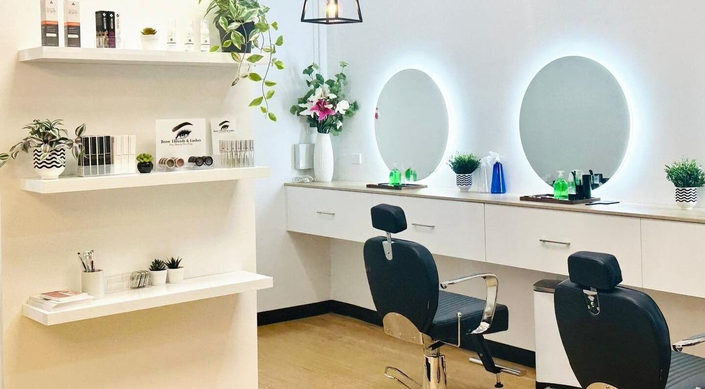 Modern beauty studio at Brow Threads & Lashes at Jetty Road, Glenelg, South Australia, AU with chic decor and mirrors.