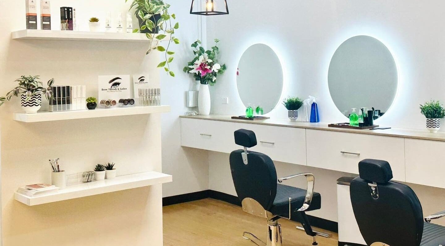 Modern beauty studio at Brow Threads & Lashes at Jetty Road, Glenelg, South Australia, AU with chic decor and mirrors.