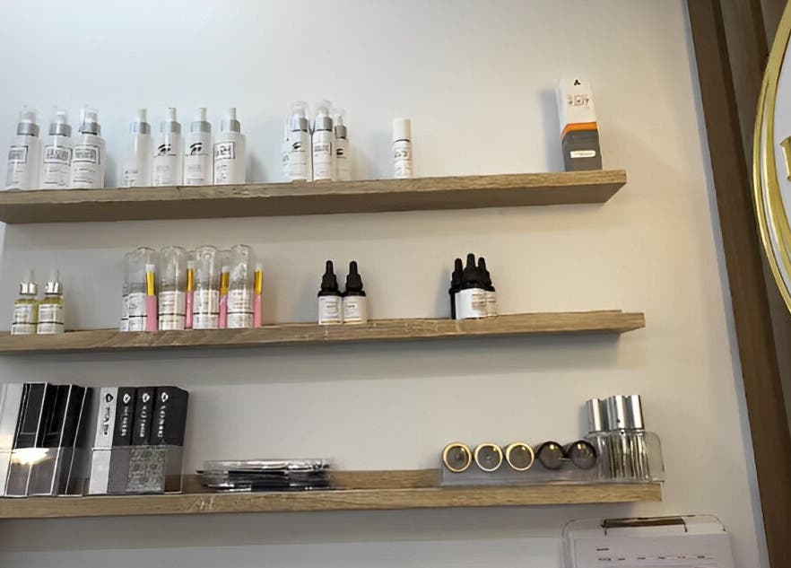 Products on wooden shelves at Brow Threads & Lashes, Jetty Road, Glenelg, South Australia, AU.