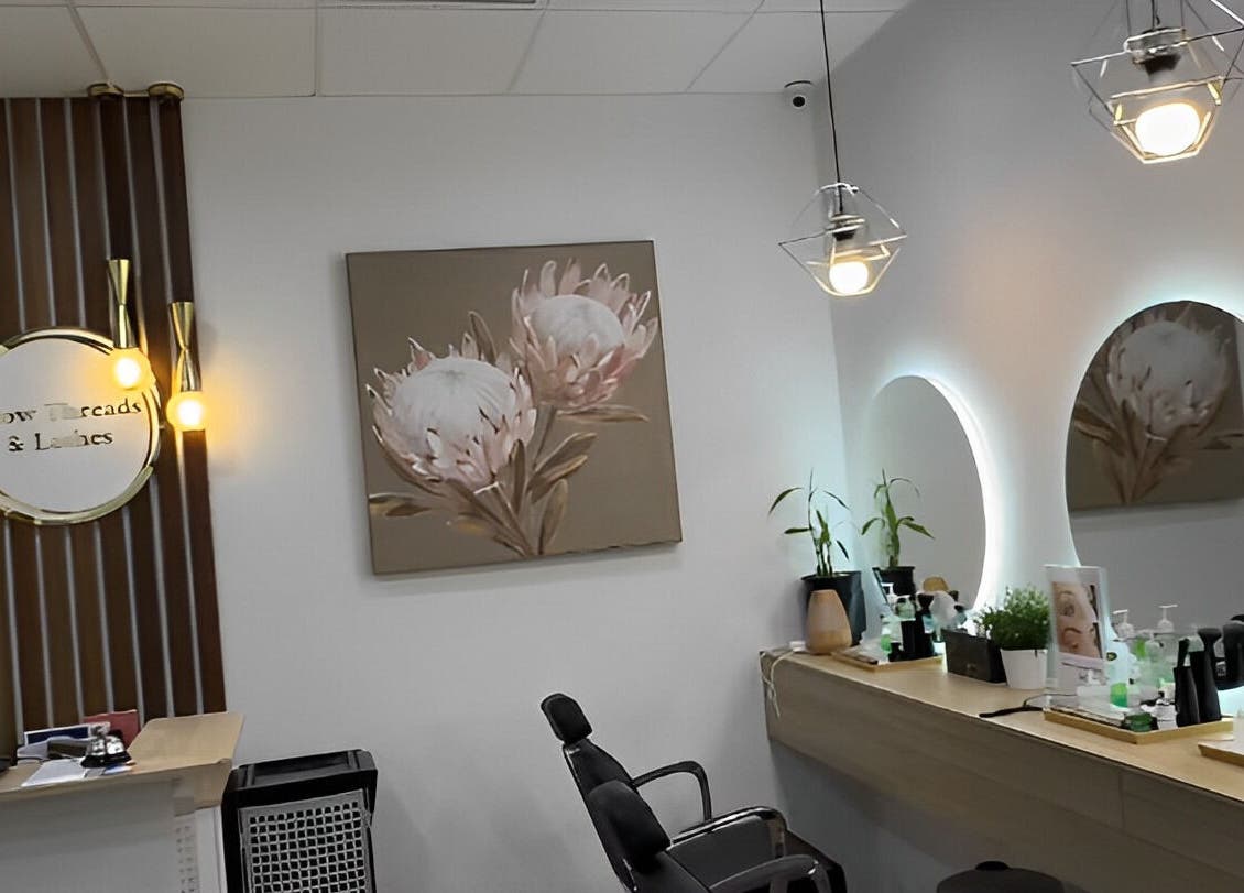 Interior of Brow Threads & Lashes at Jetty Road, Glenelg. Stylish decor with modern lighting and beauty stations.