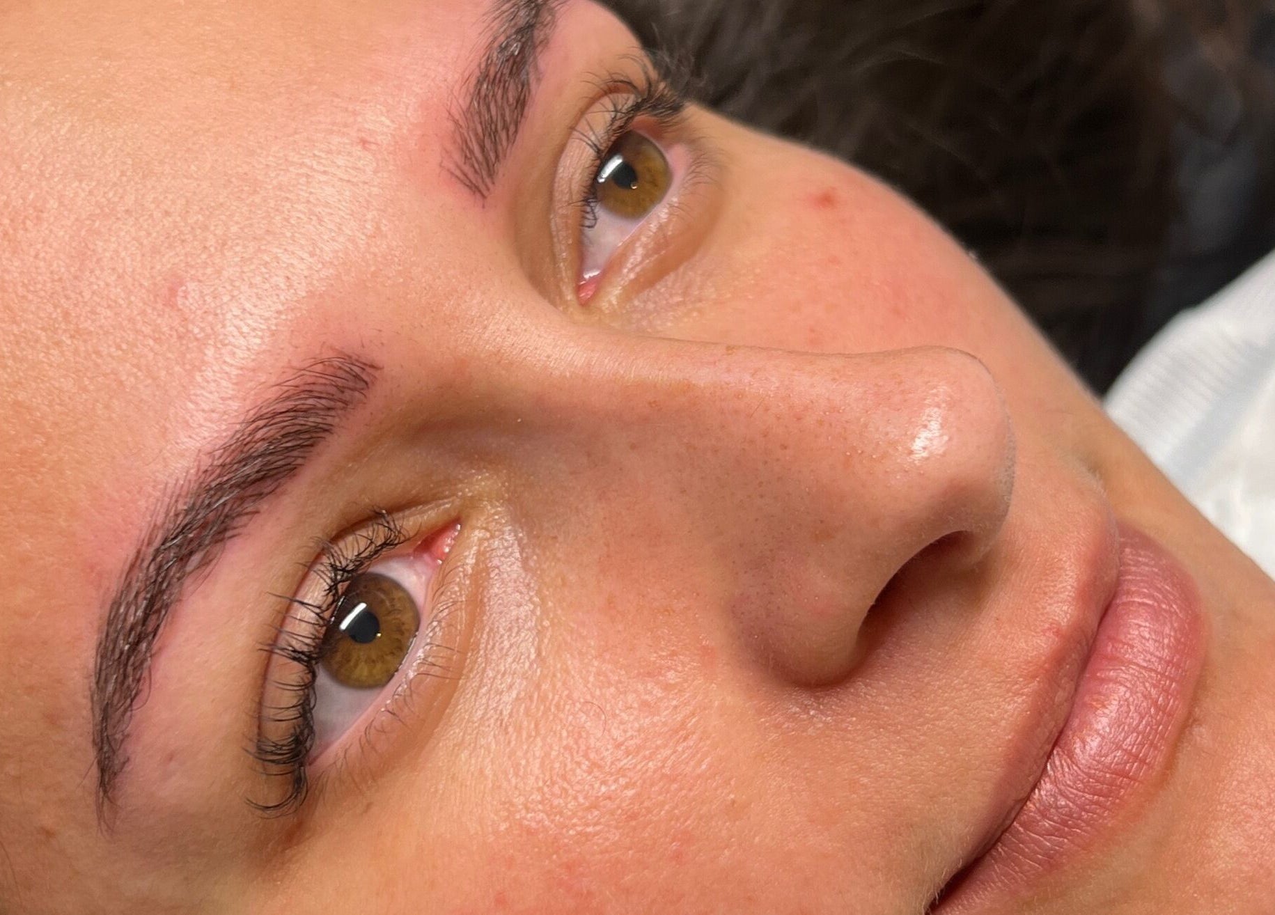 Close-up of radiant skin after treatment at Jenny Jones Ink & Aesthetics, East Grinstead, England, GB.