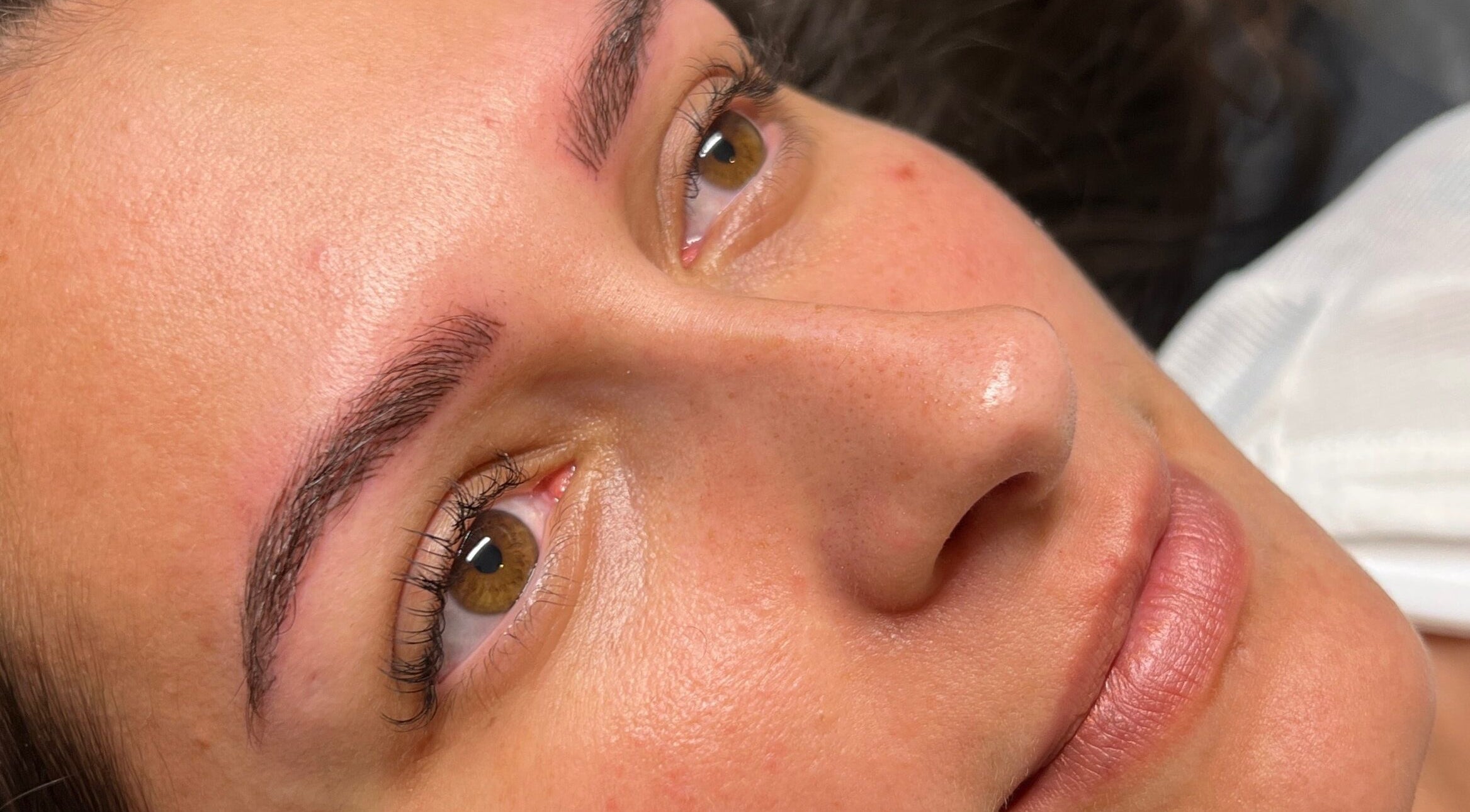 Close-up of radiant skin after treatment at Jenny Jones Ink & Aesthetics, East Grinstead, England, GB.