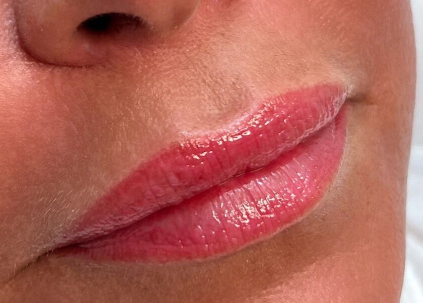 Close-up of enhanced lips at Jenny Jones Ink & Aesthetics, East Grinstead, England, GB.