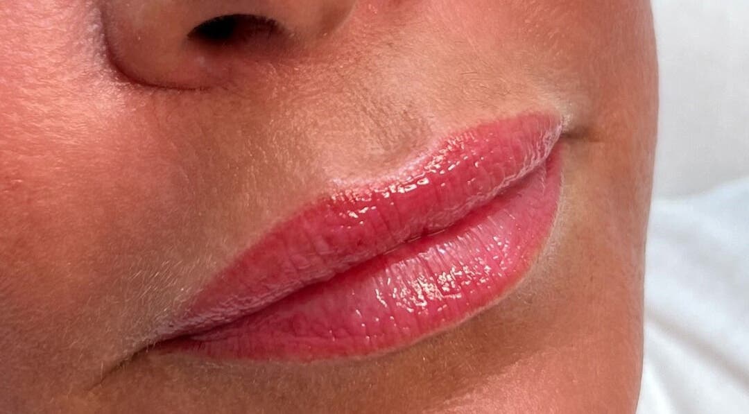 Close-up of enhanced lips at Jenny Jones Ink & Aesthetics, East Grinstead, England, GB.