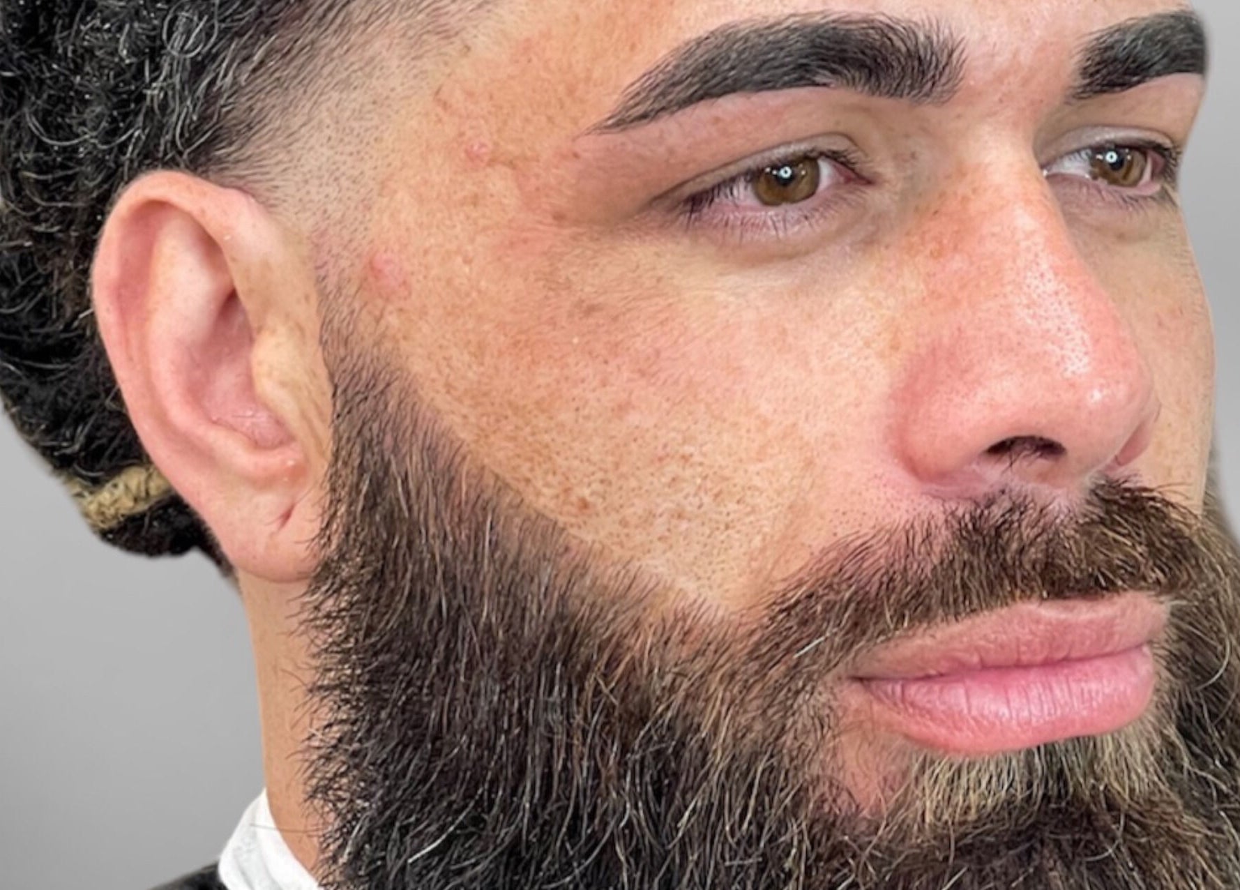 Close-up of a man's expertly groomed beard at Faded Cribb Barbershop, Te Kowhai, Waikato, NZ.