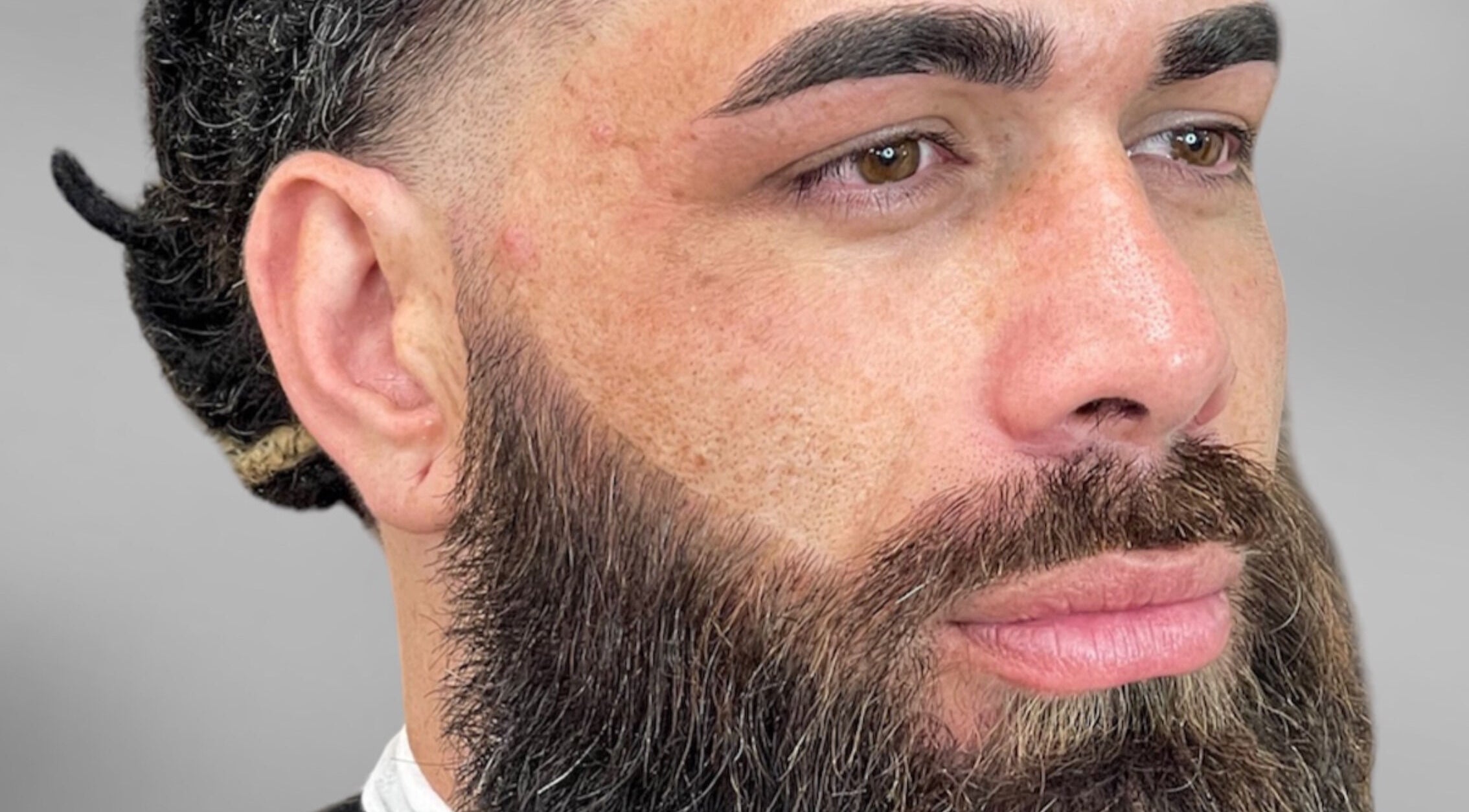 Close-up of a man's expertly groomed beard at Faded Cribb Barbershop, Te Kowhai, Waikato, NZ.