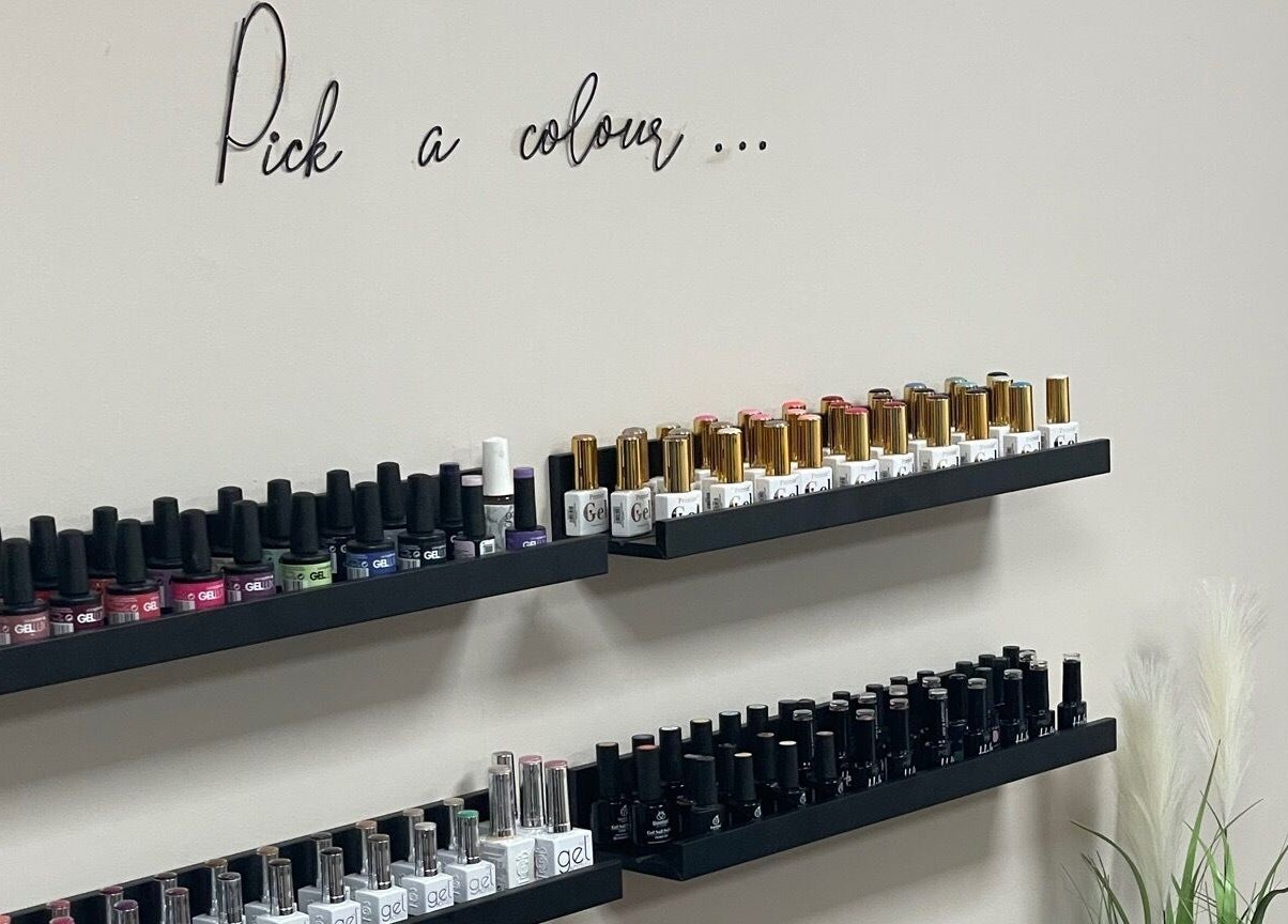 Colorful nail polish display at Studio 11 Nails and Beauty in Oakdale Caerphilly, Wales, GB.