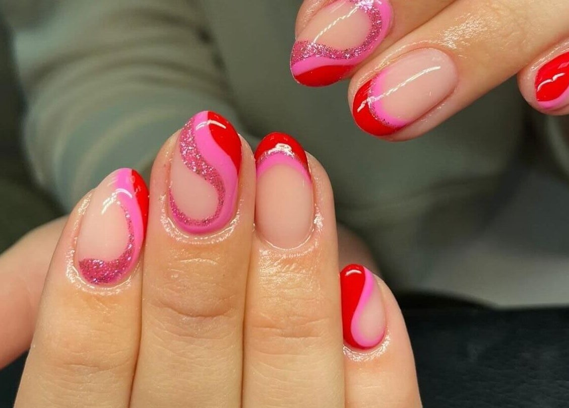 Elegant swirl red and pink nail design at Studio 11 Nails and Beauty, Oakdale Caerphilly, Wales, GB.