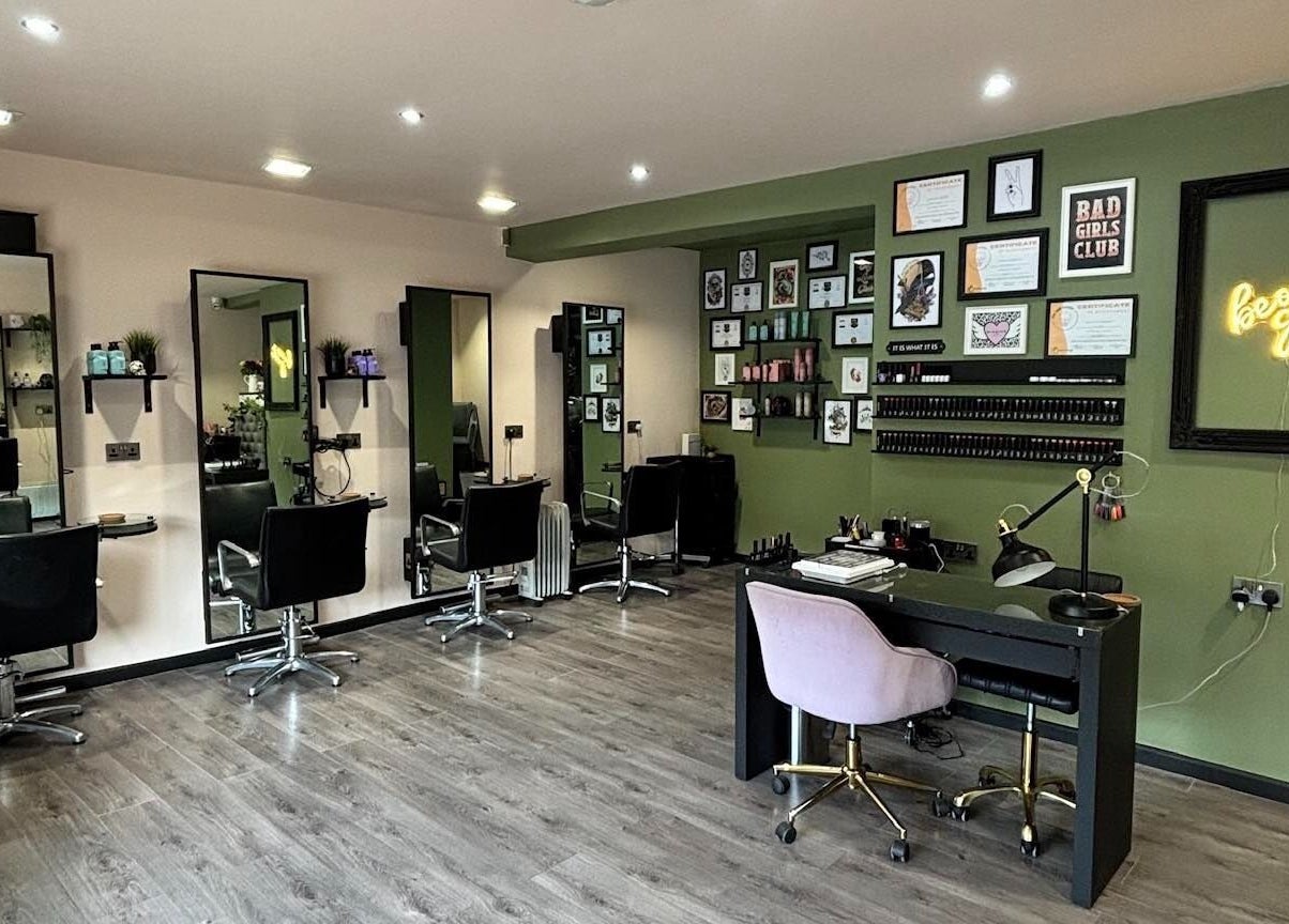 Interior of Crompton & Co salon in Heywood, England, featuring modern chairs and stylish decor.