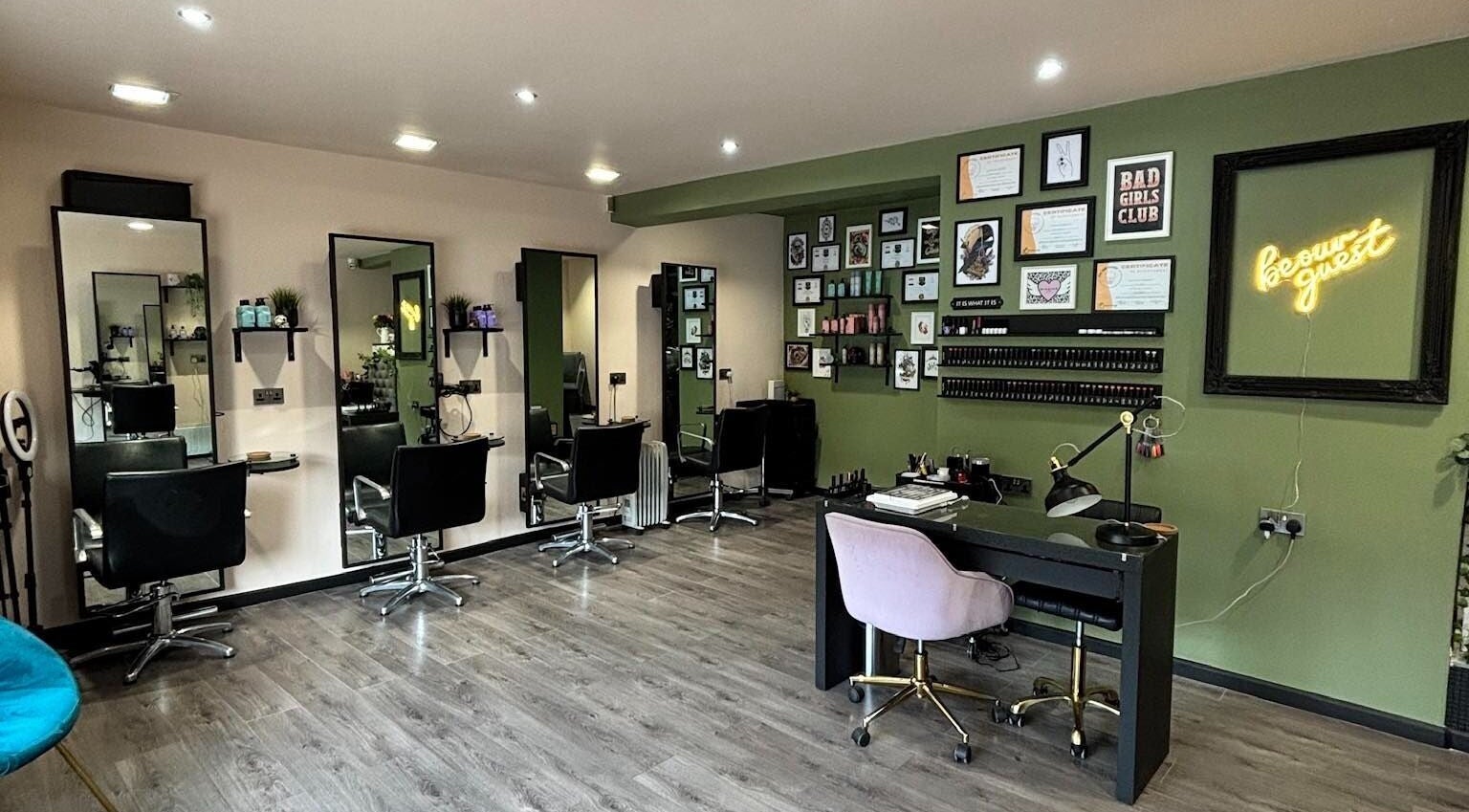 Interior of Crompton & Co salon in Heywood, England, featuring modern chairs and stylish decor.