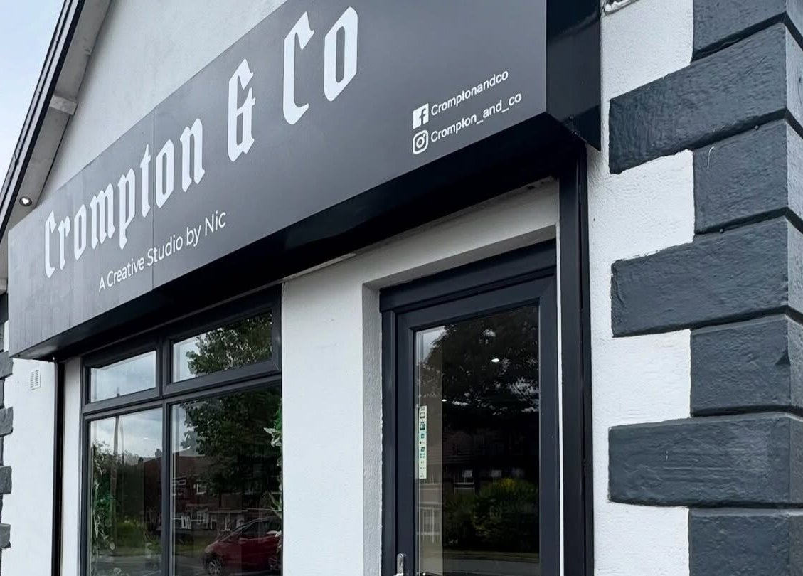 Crompton & Co's modern facade in Heywood, England, GB, showcasing sleek design and branding.