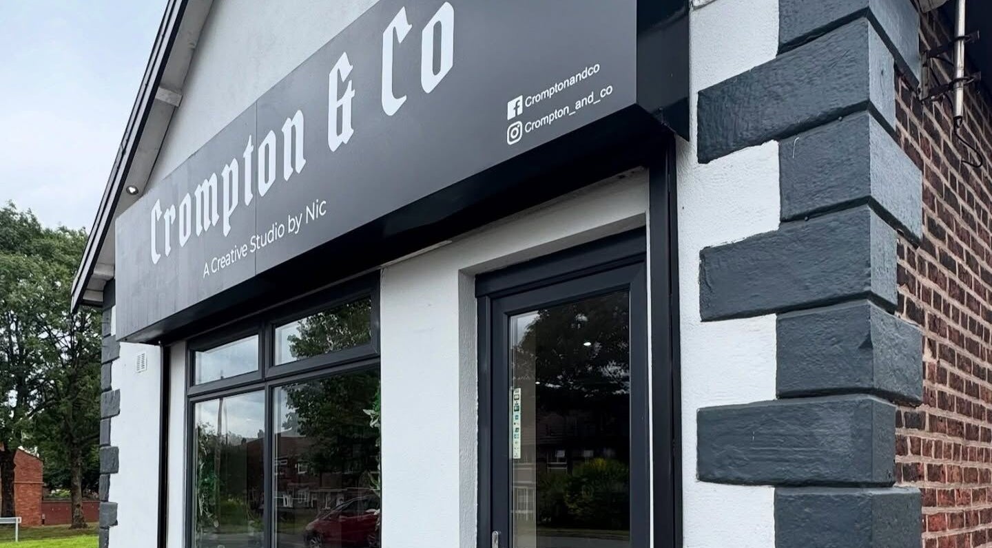 Crompton & Co's modern facade in Heywood, England, GB, showcasing sleek design and branding.