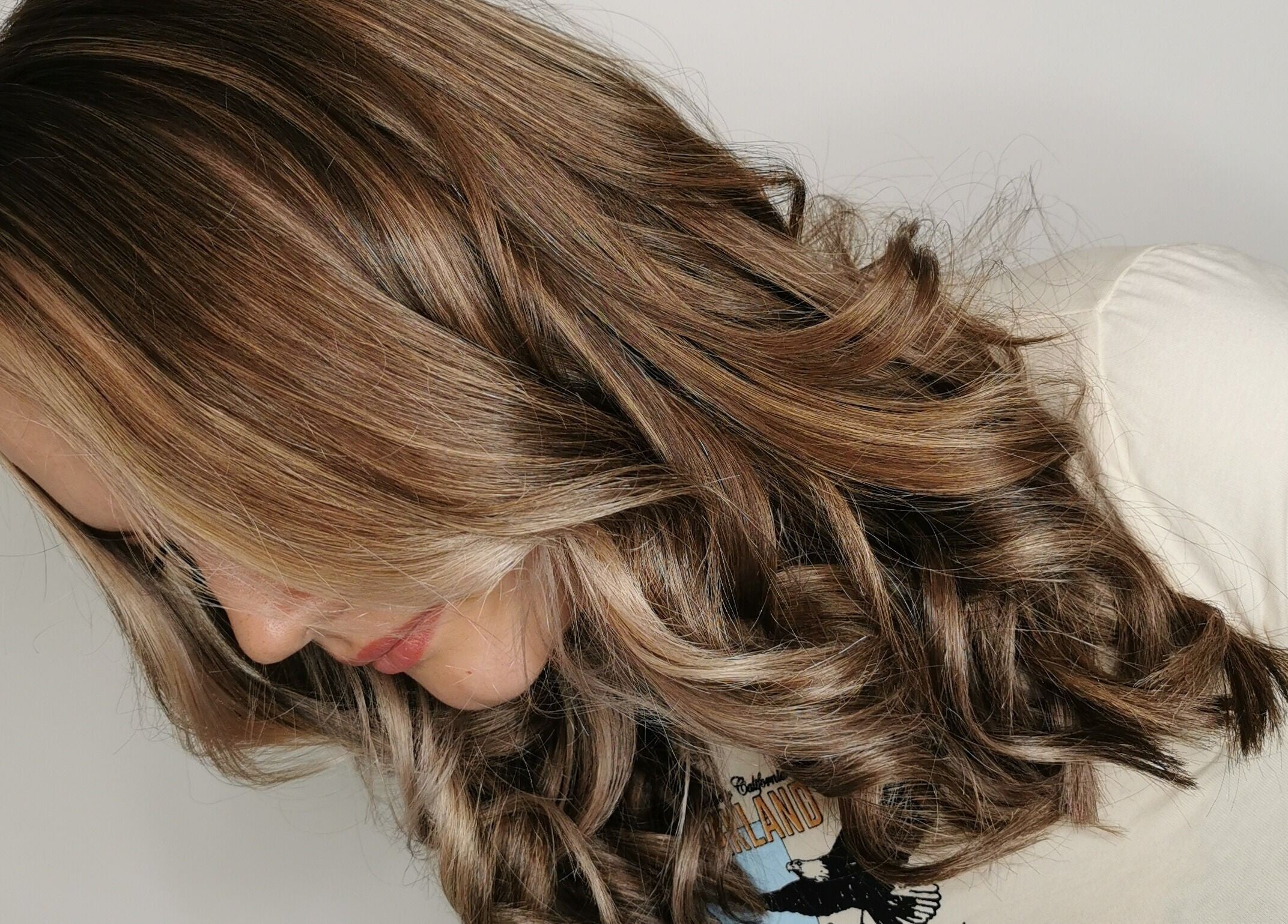 Wavy brown hair styled at Crompton & Co in Heywood, England, GB. Perfect for beauty enthusiasts.