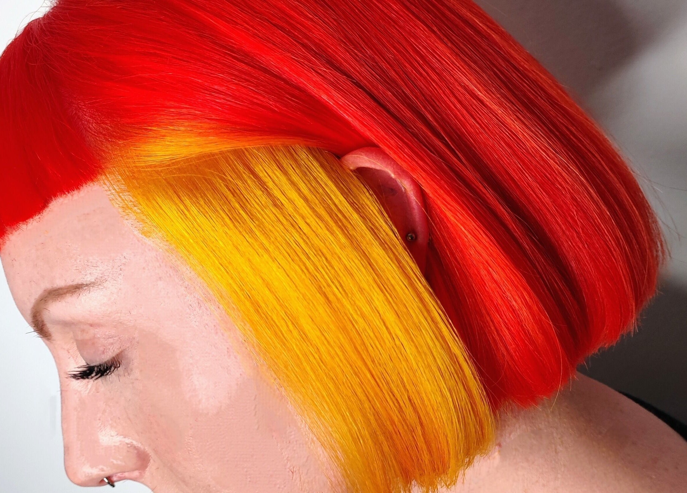 Bold red and yellow hair at Crompton & Co, Heywood, England, GB. Stunning color transformation service.