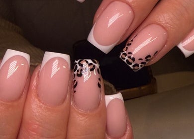 Elegant nail art with polka dot accents at Keep It Cassie, Hucclecote, England, GB.
