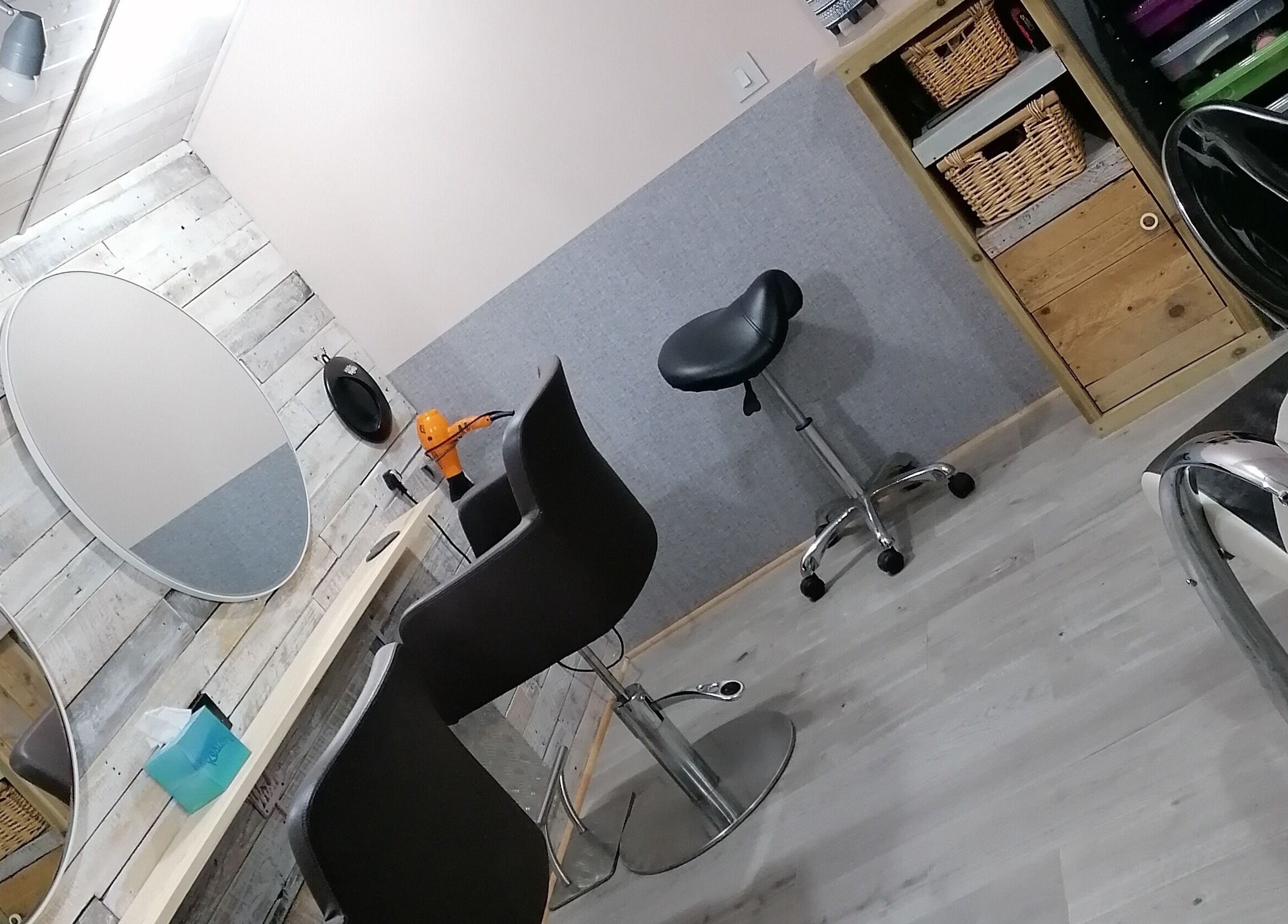 Chic salon interior at The Colourbox Hair Salon in Indian Queens, England, GB with stylish chairs and mirrors.