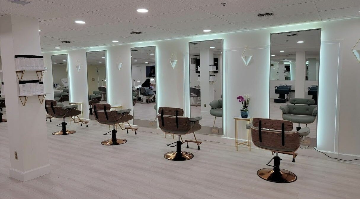 Chic interior of Royalty Salon Pasadena, California, US, showcasing modern styling stations and elegant decor.