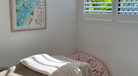 Relaxing corner at Brow Stance, Bli Bli, Queensland, AU with plush decor and soft lighting.