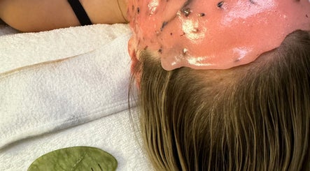 Relaxing head spa treatment with pink mask at Bare Sskin, Melbourne, Victoria, AU promoting wellness and serenity.