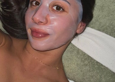Woman enjoying a rejuvenating facial mask at BARE SSKIN in Melbourne, Victoria, AU.