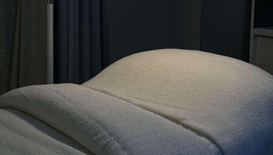 Luxurious treatment bed at BARE SSKIN, Melbourne, Victoria, AU, offering relaxing wellness experiences.