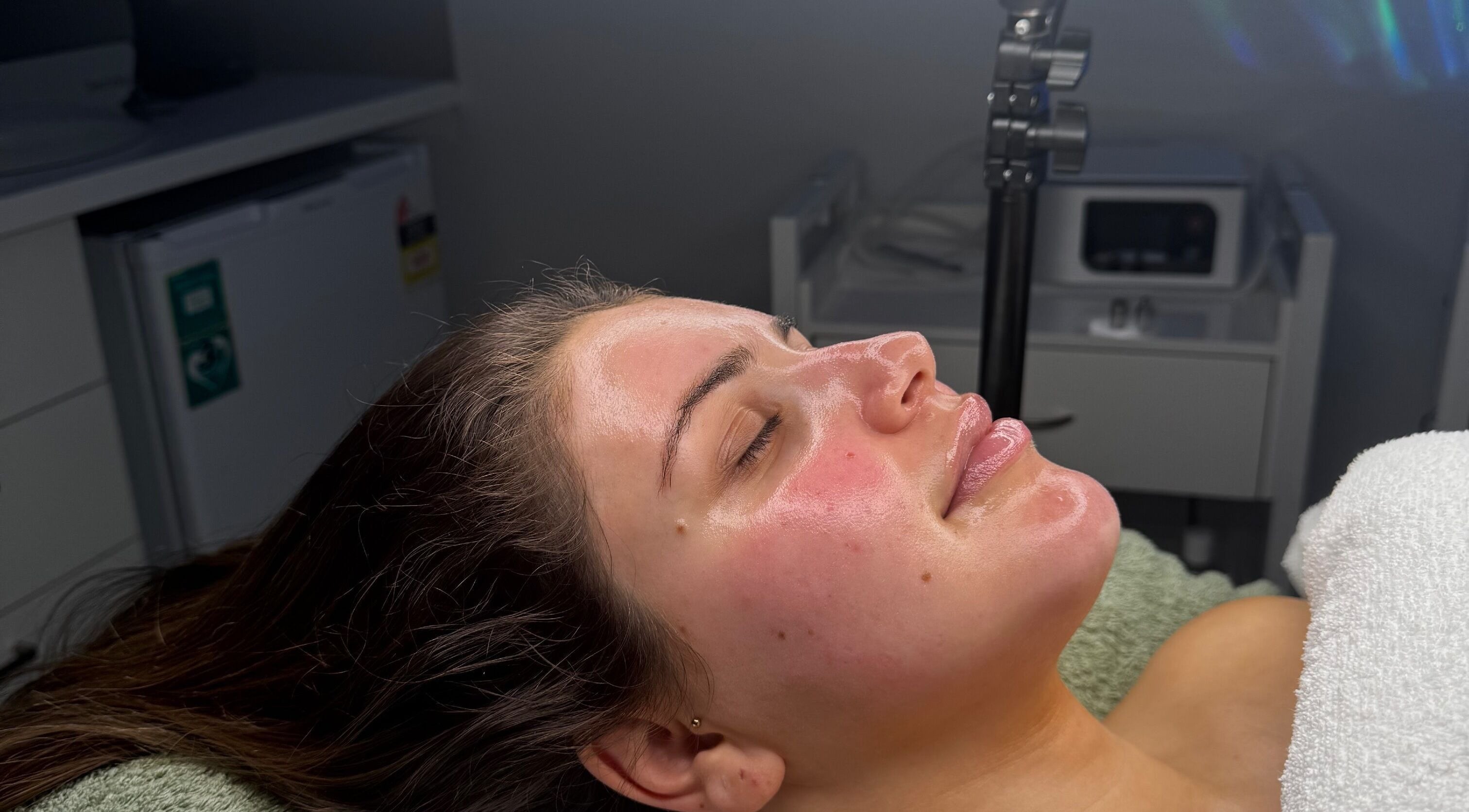 Client receiving facial treatment at BARE SSKIN in Melbourne, Victoria, AU, showcasing rejuvenated skin.