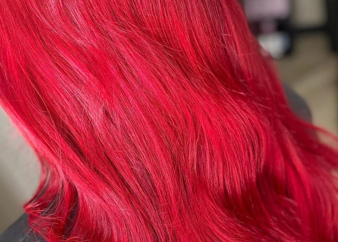 Vibrant red hair transformation at FabYouLocks, Motherwell, Scotland, GB salon enriches beauty experience.