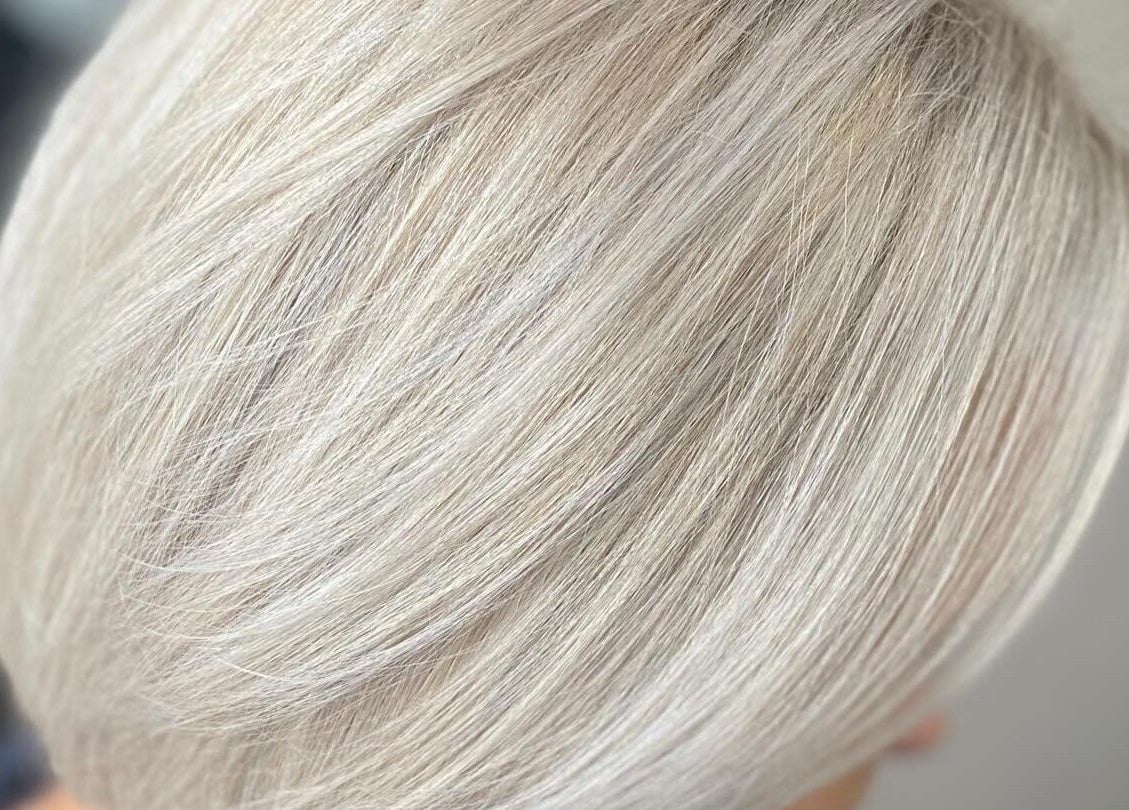 Close-up of sleek, silver-blonde hair styled at FabYouLocks, Motherwell, Scotland, GB.
