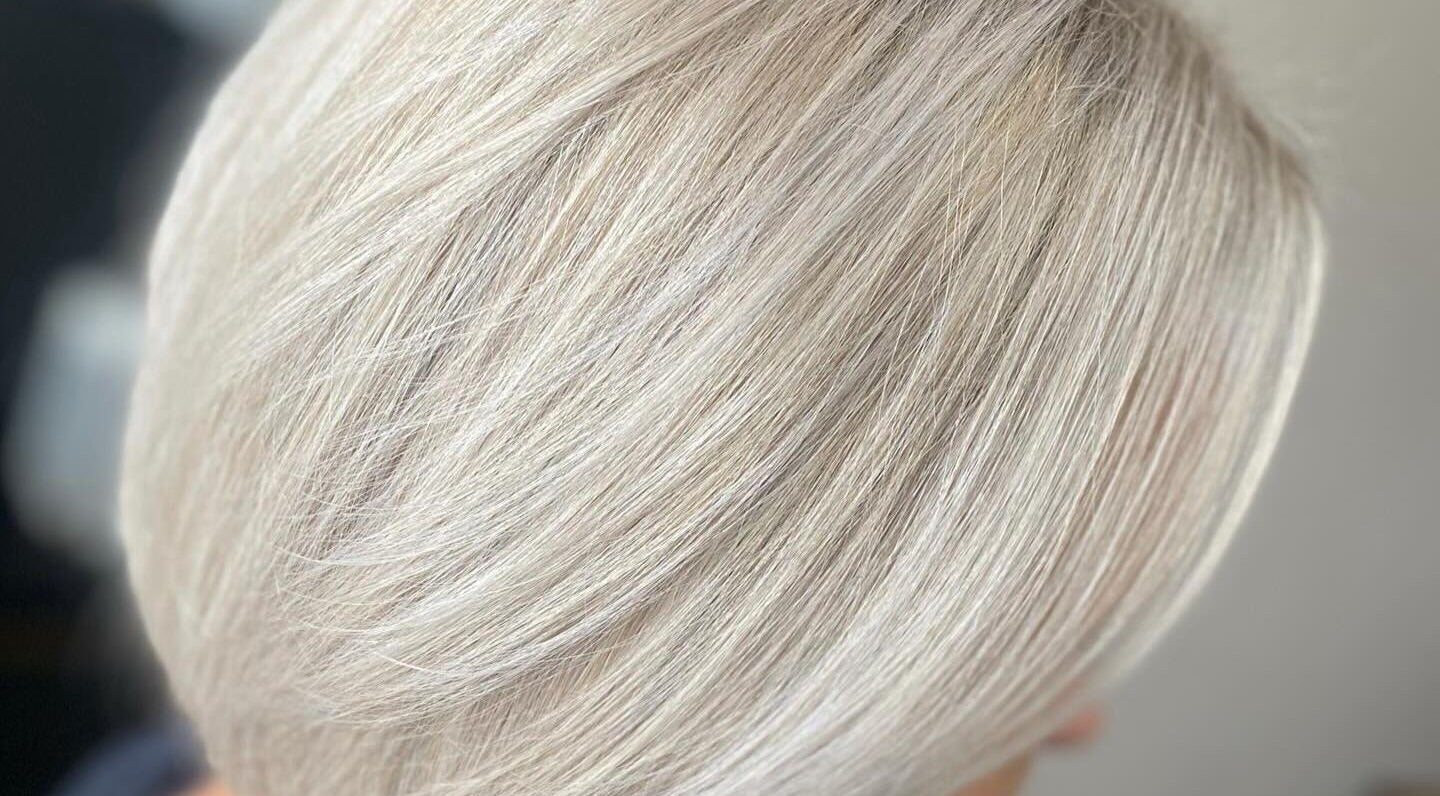 Close-up of sleek, silver-blonde hair styled at FabYouLocks, Motherwell, Scotland, GB.