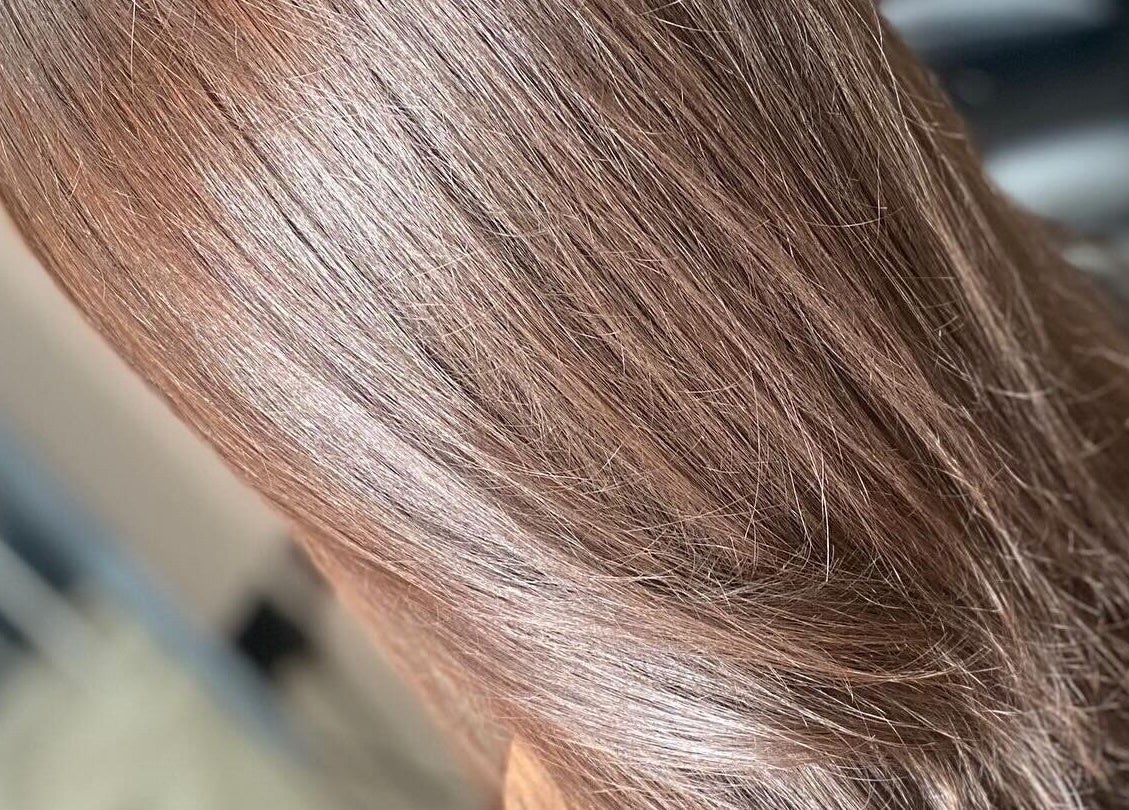 Glossy brown hair transformed at FabYouLocks in Motherwell, Scotland, GB, showcasing smooth, radiant texture.