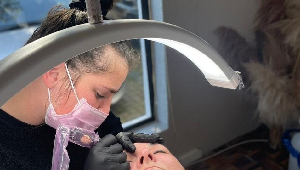 Beauty technician at Breathe Beauty Studio, Douglas, Northern Cape, ZA, performing a delicate procedure.