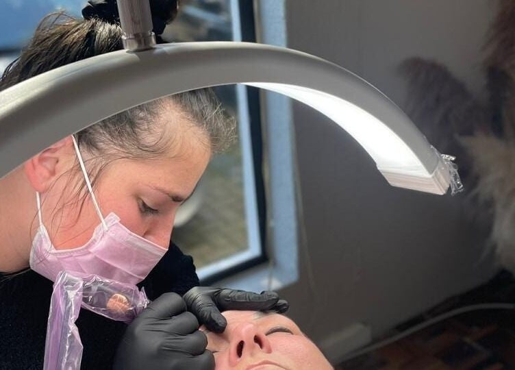 Beauty technician at Breathe Beauty Studio, Douglas, Northern Cape, ZA, performing a delicate procedure.