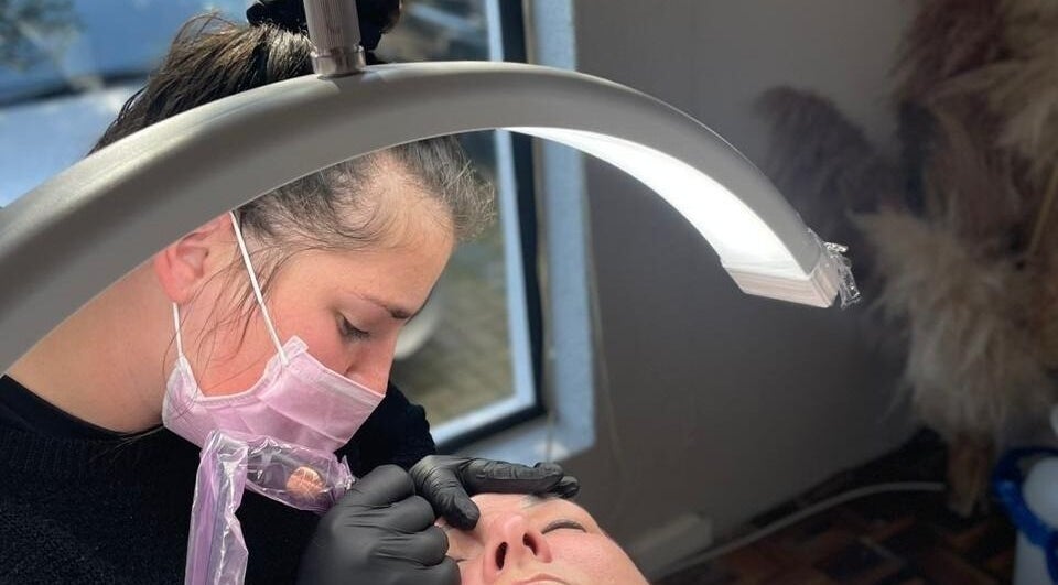 Beauty technician at Breathe Beauty Studio, Douglas, Northern Cape, ZA, performing a delicate procedure.