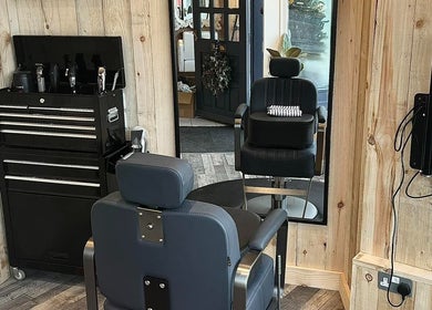 Modern barber chair and tools at RM Barbering in Stockton-on-tees, England, GB, showcasing a stylish interior.