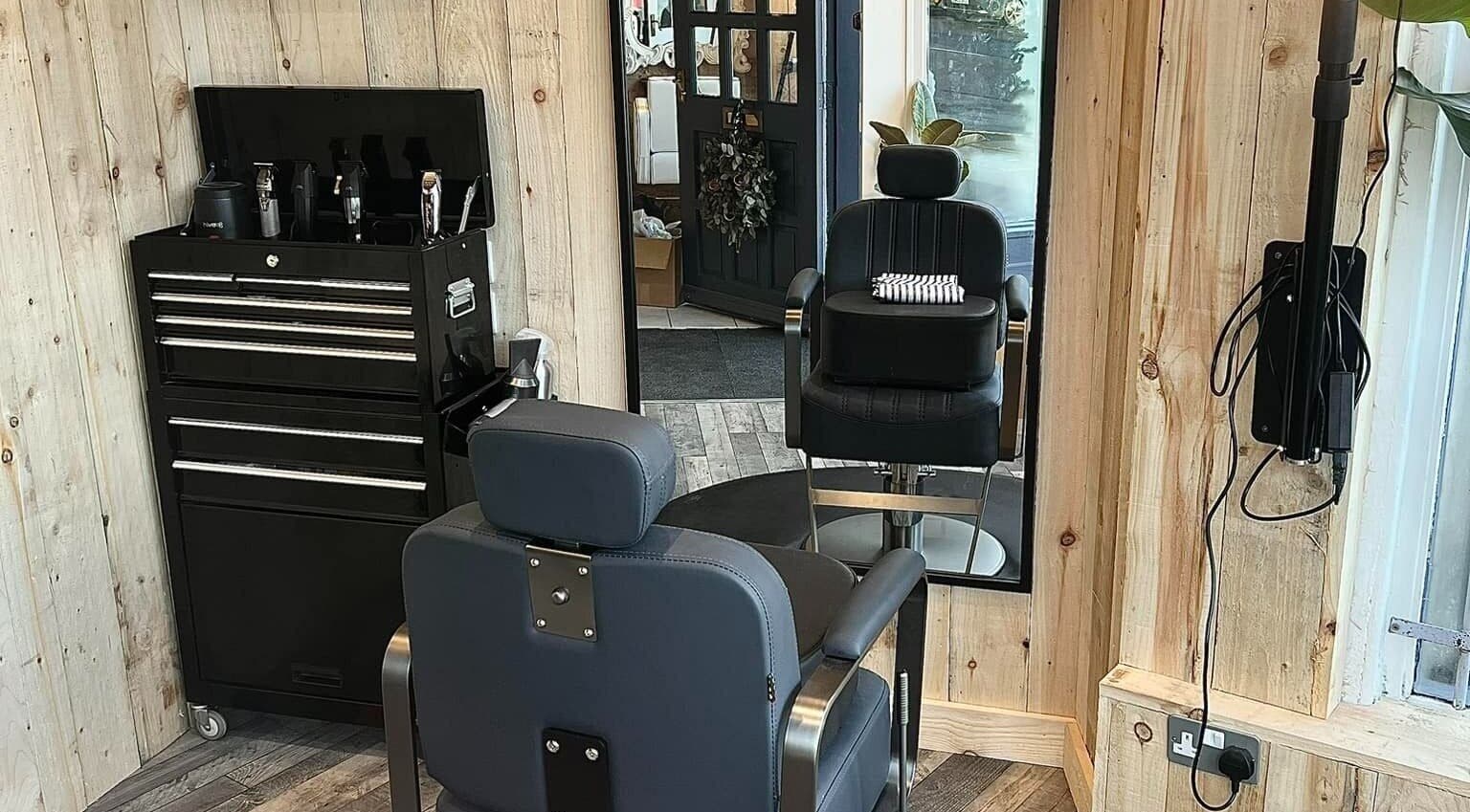 Modern barber chair and tools at RM Barbering in Stockton-on-tees, England, GB, showcasing a stylish interior.