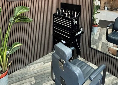 Modern barber chair in RM Barbering at Stockton-on-tees, England, GB. Stylish and contemporary setup.