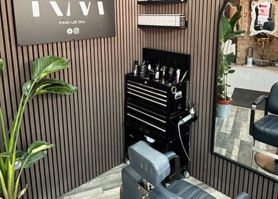 Stylish barber station at RM Barbering, Stockton-on-tees, England, featuring sleek chair and greenery.