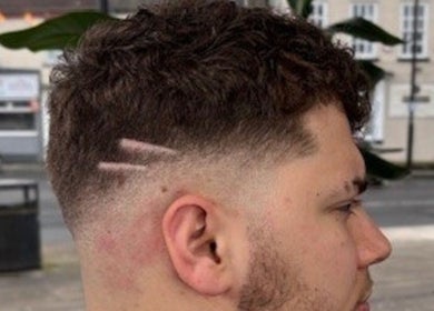 Close-up of a fade haircut with line designs from RM Barbering, Stockton-on-Tees, England, GB.