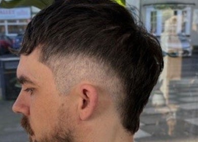 Side view of stylish men's haircut at RM Barbering, Stockton-on-Tees, England, GB.
